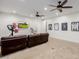 Game room featuring two leather couches and home gym equipment at 12651 S 71St St, Tempe, AZ 85287