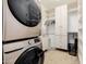 Bright laundry room with washer, dryer, and ample storage shelving at 12651 S 71St St, Tempe, AZ 85287