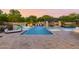 Luxury backyard oasis with a large pool, spa, outdoor kitchen, and fire pit at 12651 S 71St St, Tempe, AZ 85287