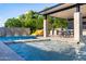 Luxury pool with a covered patio, seating, and a slide at 12651 S 71St St, Tempe, AZ 85287