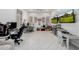 Playroom with two workspaces, ample storage, and TV at 12651 S 71St St, Tempe, AZ 85287