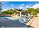 Resort-style pool and spa with covered patio and dining area at 12651 S 71St St, Tempe, AZ 85287
