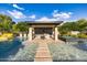 Luxury pool and spa with a covered outdoor kitchen and seating area at 12651 S 71St St, Tempe, AZ 85287