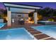 Modern outdoor kitchen with a pergola and built-in appliances at 12651 S 71St St, Tempe, AZ 85287