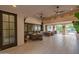 Outdoor patio with seating area, dining table, and access to backyard at 12651 S 71St St, Tempe, AZ 85287