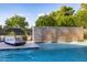 Relaxing pool area with a tranquil waterfall feature at 12651 S 71St St, Tempe, AZ 85287
