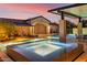 Spacious backyard with a luxurious spa and outdoor kitchen at 12651 S 71St St, Tempe, AZ 85287