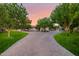 Long driveway leading to a beautiful home with lush landscaping at 12651 S 71St St, Tempe, AZ 85287