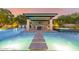 Outdoor kitchen and seating area overlooking the pool at 12651 S 71St St, Tempe, AZ 85287