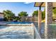 Resort-style pool with waterfall feature, spacious patio, and seating area at 12651 S 71St St, Tempe, AZ 85287