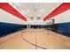 Indoor basketball and tennis court with hardwood flooring at 12651 S 71St St, Tempe, AZ 85287