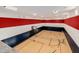 Indoor basketball and tennis court with hardwood flooring at 12651 S 71St St, Tempe, AZ 85287