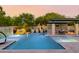 Resort-style backyard with a large pool, spa, and outdoor kitchen at 12651 S 71St St, Tempe, AZ 85287