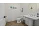 Clean and bright bathroom with pedestal sink and tiled floor at 12651 S 71St St, Tempe, AZ 85287