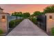 Elegant gated driveway with manicured landscaping at 12651 S 71St St, Tempe, AZ 85287