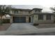 Two story house with attached garage and neutral tones at 19591 W Lincoln St, Buckeye, AZ 85326