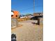 Modern home with a landscaped front yard, featuring a gravel driveway and unique rock retaining walls at 2002 W Adams St, Phoenix, AZ 85009