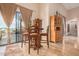 Bright breakfast nook with sliding glass doors leading to a patio and pool area at 27715 N 164Th Pl, Scottsdale, AZ 85262