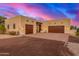 Southwest style home with double garage and desert landscaping at 27715 N 164Th Pl, Scottsdale, AZ 85262