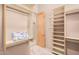 Large walk-in closet with ample shelving and hanging space at 27715 N 164Th Pl, Scottsdale, AZ 85262