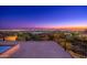 Spacious rooftop deck overlooks city lights at night; perfect for evening relaxation at 3518 N Shadow Trl, Mesa, AZ 85207