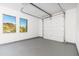 Spacious garage with automatic door and windows at 3518 N Shadow Trl, Mesa, AZ 85207