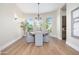 Bright dining room with hardwood floors, chandelier, and views at 3518 N Shadow Trl, Mesa, AZ 85207