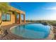 Inviting kidney-shaped pool with brick coping at 3518 N Shadow Trl, Mesa, AZ 85207