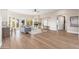 Spacious living room featuring hardwood floors, a fireplace, and large windows at 3518 N Shadow Trl, Mesa, AZ 85207