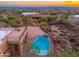 Aerial view of a modern home with a pristine pool and city views at 3518 N Shadow Trl, Mesa, AZ 85207