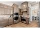 Modern kitchen with stainless steel appliances and custom wood cabinetry at 3518 N Shadow Trl, Mesa, AZ 85207