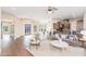 Open floor plan living area with hardwood floors and a cozy seating arrangement at 3518 N Shadow Trl, Mesa, AZ 85207
