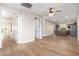 Open living room with hardwood floors and kitchen access at 3518 N Shadow Trl, Mesa, AZ 85207
