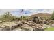 Community entrance with a scenic waterfall feature at 3518 N Shadow Trl, Mesa, AZ 85207