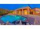 Luxury pool with a waterfall feature and spacious deck; resort-style backyard at 3518 N Shadow Trl, Mesa, AZ 85207