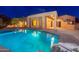 Expansive pool and modern house exterior at dusk at 3518 N Shadow Trl, Mesa, AZ 85207