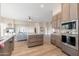 Modern kitchen with wooden cabinetry, stainless steel appliances, and an island at 3518 N Shadow Trl, Mesa, AZ 85207