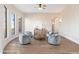 Elegant sitting area with hardwood floors and large windows with hill views at 3518 N Shadow Trl, Mesa, AZ 85207