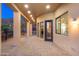 Covered patio features a brick floor and access to the backyard; offers outdoor living space at 3518 N Shadow Trl, Mesa, AZ 85207