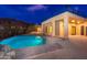 Inviting pool and patio area with modern house exterior at dusk at 3518 N Shadow Trl, Mesa, AZ 85207