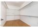 Large walk-in closet with wood floors and shelving at 902 E Goldenrod St, Phoenix, AZ 85048