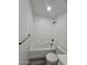 Clean bathroom with a bathtub, toilet and shower at 2002 W Adams St, Phoenix, AZ 85009