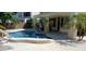 Inviting pool area with covered patio and seating at 6251 S Moccasin Trl, Gilbert, AZ 85298