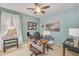 Bright home office features a large desk and ample natural light at 6251 S Moccasin Trl, Gilbert, AZ 85298