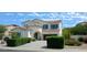 Two-story house with blue shutters, landscaping, and a driveway at 6251 S Moccasin Trl, Gilbert, AZ 85298