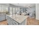 Open concept kitchen with granite island and views into the living room at 6251 S Moccasin Trl, Gilbert, AZ 85298