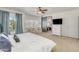 Main bedroom suite with king-size bed, sitting area, and ensuite bathroom at 6251 S Moccasin Trl, Gilbert, AZ 85298