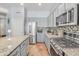 Well-equipped kitchen featuring stainless steel appliances and granite counters at 6251 S Moccasin Trl, Gilbert, AZ 85298