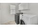 Convenient laundry room with washer, dryer, and cabinets at 6251 S Moccasin Trl, Gilbert, AZ 85298