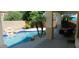 Covered patio overlooking refreshing pool and spa at 6251 S Moccasin Trl, Gilbert, AZ 85298